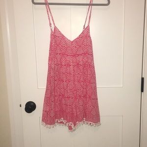 Romper in the back, dress in the front. Never worn